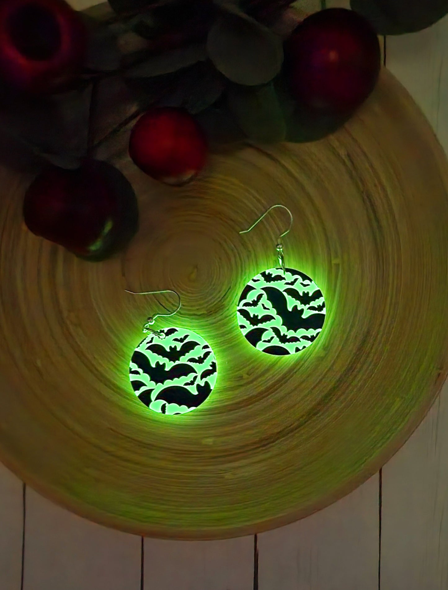 Watch these glow!  White acrylic white rounds with black bats flying.  These glow in the dark!